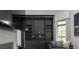 Bright living room featuring a built-in bookcase, shelving and a comfortable place to sit at 4100 Oak Hill Rd, Douglasville, GA 30135