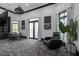 Spacious living room with neutral decor, modern lighting, and a comfortable sitting area near French doors at 4100 Oak Hill Rd, Douglasville, GA 30135