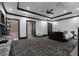 Spacious main bedroom with wet bar, hidden TV, and access to staircase at 4100 Oak Hill Rd, Douglasville, GA 30135