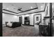 Open-concept main bedroom with wet bar, fireplace, and hidden television at 4100 Oak Hill Rd, Douglasville, GA 30135