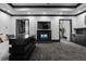 Main bedroom features a hidden TV, fireplace, and convenient wet bar area at 4100 Oak Hill Rd, Douglasville, GA 30135