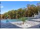 Backyard pool with stone surround, water features, and a view of the wooded landscape at 4100 Oak Hill Rd, Douglasville, GA 30135