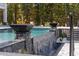 Stunning pool area with fire features, waterfall, and stone accents, creating a luxurious outdoor space at 4100 Oak Hill Rd, Douglasville, GA 30135