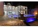 Luxury home featuring an outdoor pool with integrated waterfall and fire bowls, perfect for upscale entertaining at 4100 Oak Hill Rd, Douglasville, GA 30135