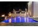 Beautiful in-ground swimming pool, fire bowls, and a staircase to the landscaped yard in this luxurious backyard at 4100 Oak Hill Rd, Douglasville, GA 30135