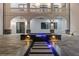 Beautiful backyard featuring a pool, archways, and a modern water feature; sophisticated outdoor living and entertaining space at 4100 Oak Hill Rd, Douglasville, GA 30135