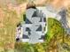 Overhead view highlights the gray roof of the house, long driveway, and the outdoor living spaces at 4539 Tiffany Ln, Loganville, GA 30052