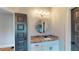 Charming bathroom features a granite vanity, mirror, and light fixtures at 4539 Tiffany Ln, Loganville, GA 30052