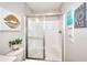 Cozy bathroom featuring a glass shower stall and stylish decorations at 4539 Tiffany Ln, Loganville, GA 30052