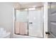 Bathroom with shower featuring sliding glass doors and tiled walls at 4539 Tiffany Ln, Loganville, GA 30052