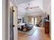 Bright bedroom boasts a trey ceiling, hardwood floors, barn door access to the rear balcony, and a seating area at 4539 Tiffany Ln, Loganville, GA 30052