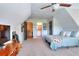 Upstairs bedroom featuring pitched ceilings and an en-suite bathroom at 4539 Tiffany Ln, Loganville, GA 30052
