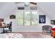 Cozy bedroom space with sporty decor and large window with a view at 4539 Tiffany Ln, Loganville, GA 30052