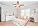 Bright bedroom with a ceiling fan, decor, and large window for light at 4539 Tiffany Ln, Loganville, GA 30052
