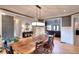 Formal dining room with modern chandelier, seating for six and hardwood floors at 4539 Tiffany Ln, Loganville, GA 30052