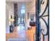 Inviting foyer with hardwood floors, stone wall feature and wrought iron front door at 4539 Tiffany Ln, Loganville, GA 30052