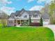Beautiful two-story home featuring stone accents and a well-manicured lawn at 4539 Tiffany Ln, Loganville, GA 30052