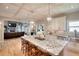 Well-lit kitchen with views into living room and stainless steel appliances at 4539 Tiffany Ln, Loganville, GA 30052