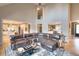 Spacious living room with high ceilings, leather sectional, and views into the kitchen at 4539 Tiffany Ln, Loganville, GA 30052