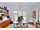 Bright home office with large window, coffered ceilings, and wood cabinetry at 4539 Tiffany Ln, Loganville, GA 30052