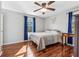 Bedroom with hardwood floors, complemented by natural light and simple furnishings at 5129 Valley Forge Rd, Stone Mountain, GA 30087