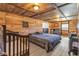 Cozy bedroom featuring wood paneled walls and ceiling, with a comfortable looking bed at 8989 E Cherokee Dr, Canton, GA 30115