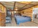 Spacious bedroom with rustic wood walls, ample storage, and natural light at 8989 E Cherokee Dr, Canton, GA 30115