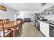 Open-concept kitchen and dining flowing to living room with comfortable seating at 8989 E Cherokee Dr, Canton, GA 30115
