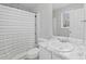 Bright bathroom featuring a shower with a modern curtain, a large mirror and stylish vanity at 951 Orchard Mill Ln, Lawrenceville, GA 30043