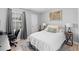 Cozy bedroom with a guitar, desk, comfortable bed, and natural light from the window at 951 Orchard Mill Ln, Lawrenceville, GA 30043