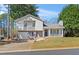 Charming two-story home with attached garage, well-maintained lawn, and inviting front porch at 951 Orchard Mill Ln, Lawrenceville, GA 30043