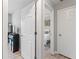Hallway with open doorways leading to a bedroom, with new laminate floors and fresh paint at 951 Orchard Mill Ln, Lawrenceville, GA 30043