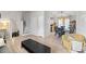 Open living room leading to the dining area, ideal for entertaining at 951 Orchard Mill Ln, Lawrenceville, GA 30043