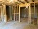 Unfinished basement showing framing, concrete floor, and staircase at 108 Deer Xing, Temple, GA 30179