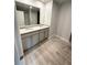 Well-lit bathroom featuring dual sinks and granite countertops at 108 Deer Xing, Temple, GA 30179