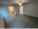 Bedroom with carpet flooring featuring a fan and two door entries at 108 Deer Xing, Temple, GA 30179