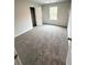 Bedroom with natural light, a closet, and soft carpeting at 108 Deer Xing, Temple, GA 30179