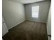 Cozy bedroom with neutral carpet and a bright window at 108 Deer Xing, Temple, GA 30179