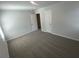 Well-lit bedroom featuring carpet and an open closet for storage at 108 Deer Xing, Temple, GA 30179
