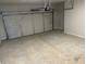 Spacious two-car garage featuring concrete flooring and an automatic door opener at 108 Deer Xing, Temple, GA 30179