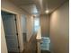 Hallway with neutral color, carpet, and access to the upper level at 108 Deer Xing, Temple, GA 30179