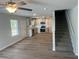 Open concept floor plan of kitchen featuring modern appliances, and gray shaker cabinets at 108 Deer Xing, Temple, GA 30179