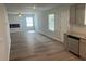 Open living space showcasing a fireplace, ceiling fan, and modern lighting fixtures at 108 Deer Xing, Temple, GA 30179