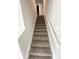 Carpeted staircase leading to the lower level of the home at 108 Deer Xing, Temple, GA 30179