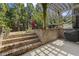 A backyard patio featuring a grill, retaining wall and patio at 1214 Oglethorpe Ne Ave, Brookhaven, GA 30319
