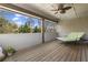 Covered porch with wood flooring, a ceiling fan, and a lounger, great for enjoying the outdoors at 1214 Oglethorpe Ne Ave, Brookhaven, GA 30319