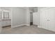 Bedroom featuring neutral walls, carpeting, with an open bathroom at 1214 Oglethorpe Ne Ave, Brookhaven, GA 30319
