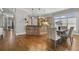 Open-concept layout connecting kitchen and dining areas, with hardwood floors throughout at 1214 Oglethorpe Ne Ave, Brookhaven, GA 30319