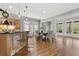 Bright dining area with hardwood floors, lots of windows, and stylish modern lighting at 1214 Oglethorpe Ne Ave, Brookhaven, GA 30319