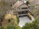 An aerial view of a two story house showcasing an attached garage and outdoor balconies at 1214 Oglethorpe Ne Ave, Brookhaven, GA 30319